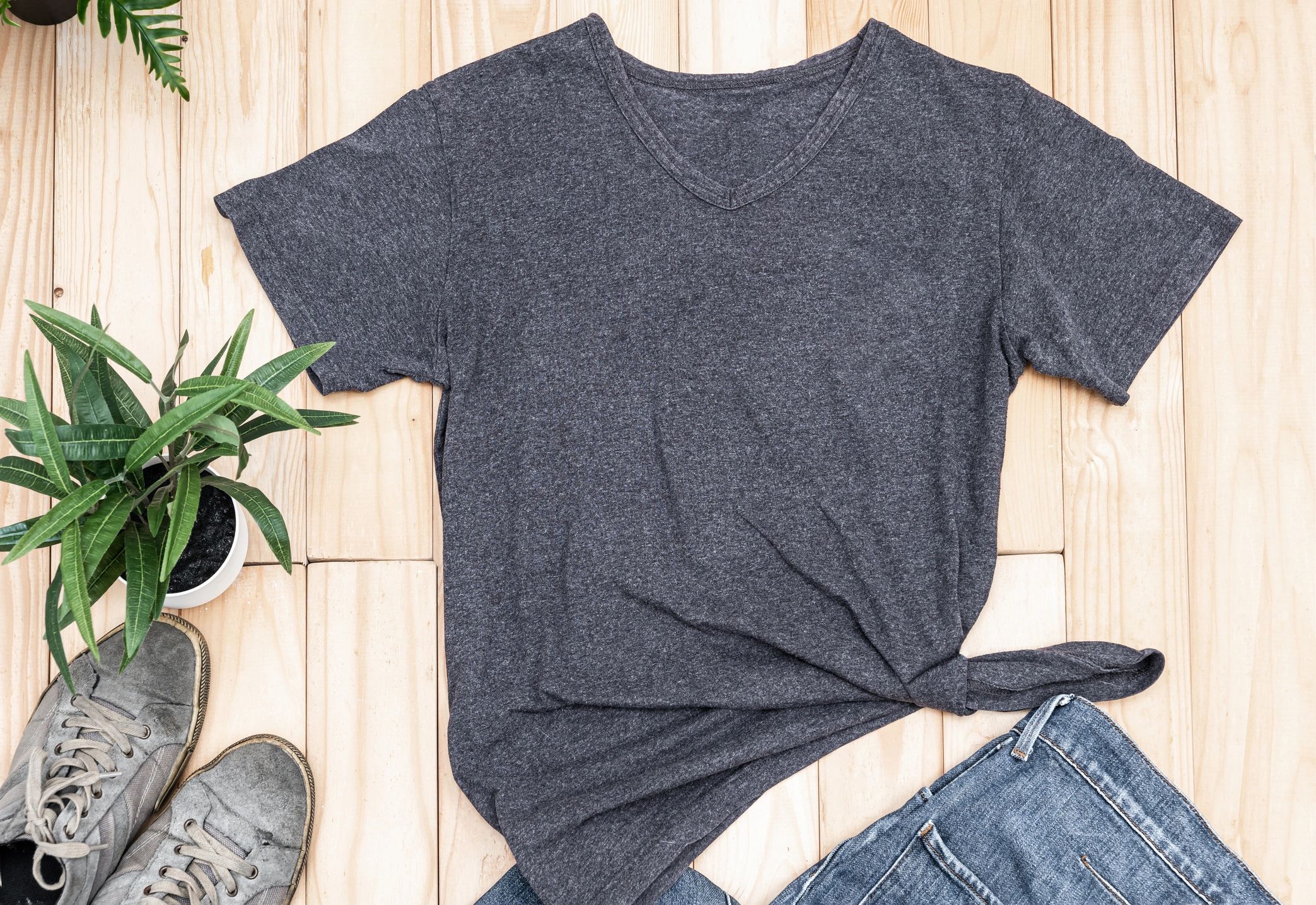 Graphic t-shirt flat lay on rustic background