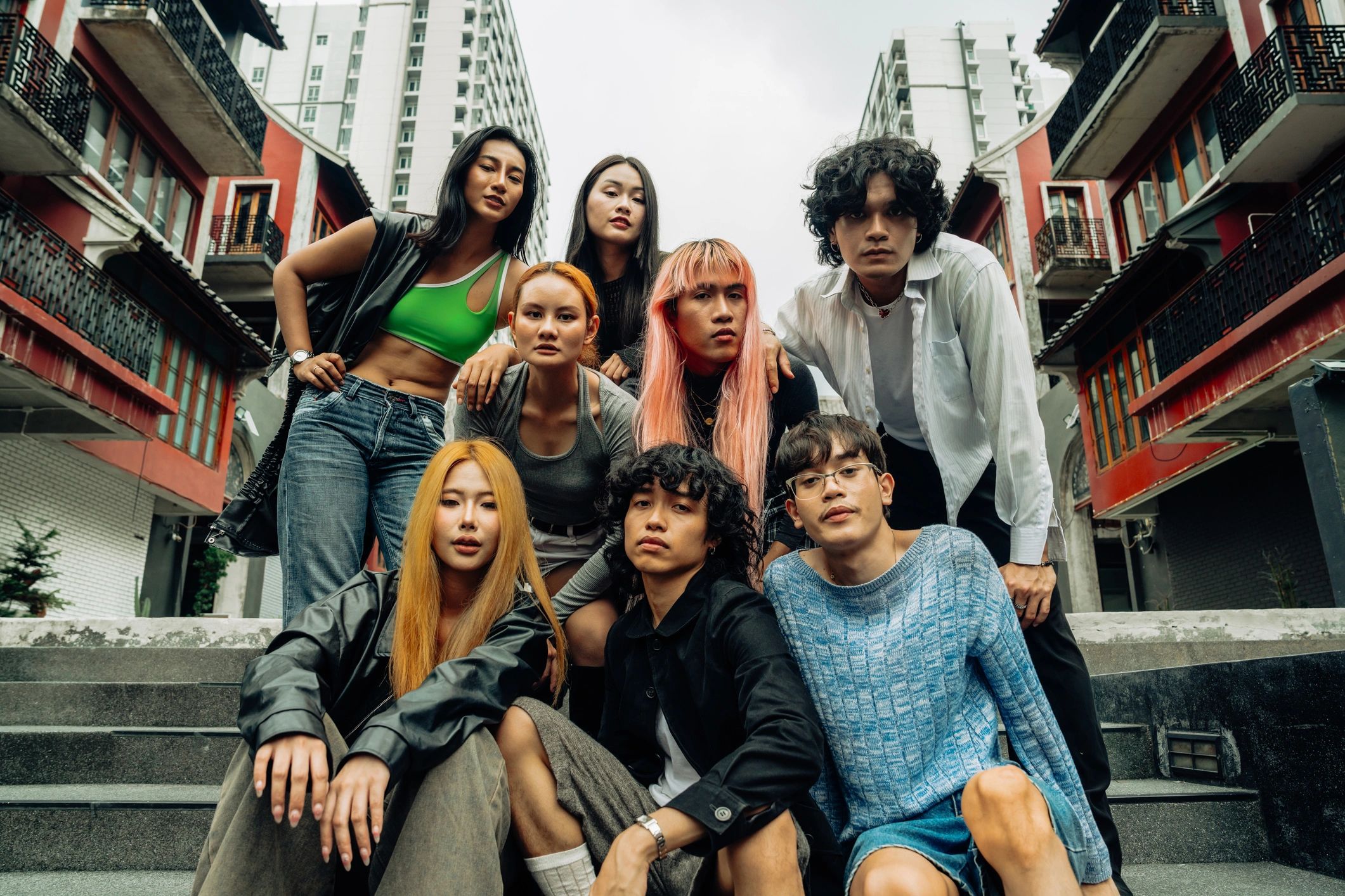 Stylish young adults posing together in an urban setting