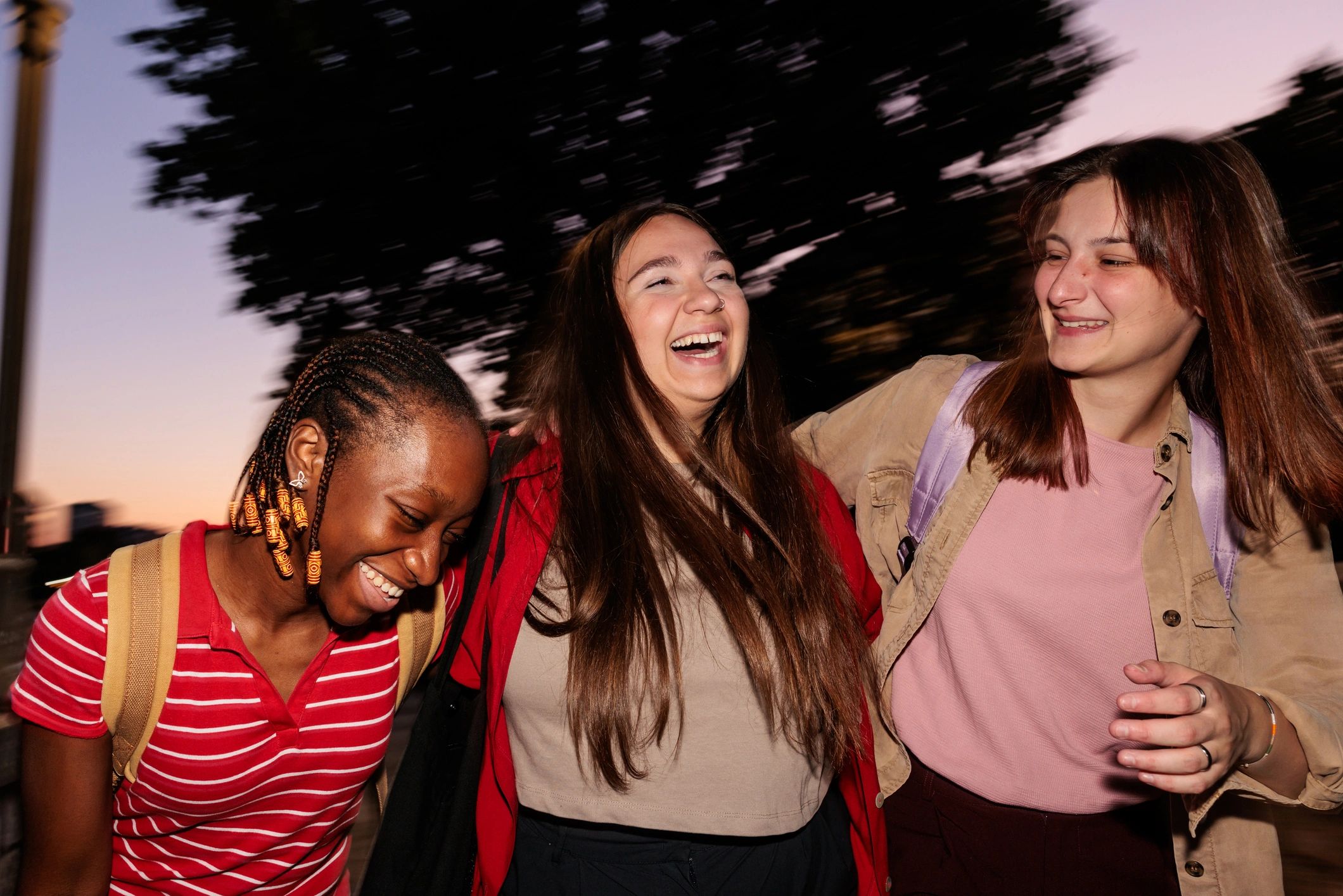 Happy customer laughing with friends at night
